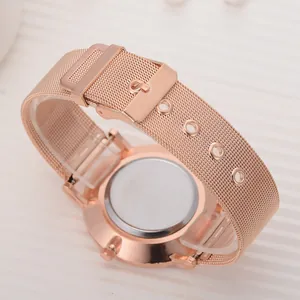 Detail of rose gold mesh watch band with pin buckle and polished stainless steel back