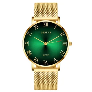 Detail of green sunray dial with Roman numerals and golden mesh strap quartz watch