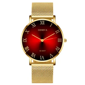 Detail of Roman numeral quartz watch with gold Milanese mesh band and red gradient dial