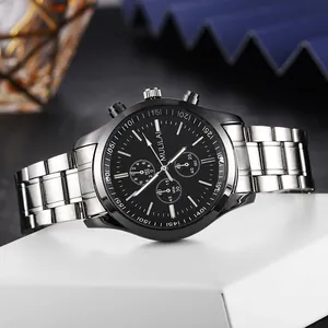 Macro shot of silver steel strap and black dial chronograph watch on a display stand