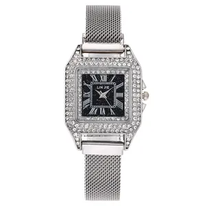Montre carrée argentée pour femme avec lunette en strass et cadran étoilé noir