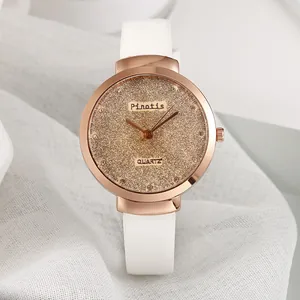 Montre à quartz pour femme avec boîtier or rose, bracelet en cuir blanc et cadran pailleté