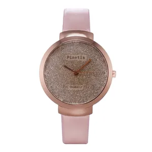 Montre à quartz pour femme avec cadran rose étoilé et boîtier en métal or rose