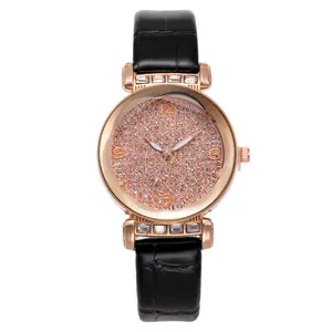 Elegant rose gold women's quartz watch with pink glitter dial and black leather strap