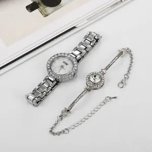 Macro view of women's silver watch and diamond bracelet set on a fashion magazine