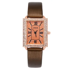 Women's rectangular rose gold quartz watch with diamond-set bezel and brown leather strap
