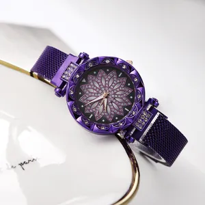 Macro view of purple lotus dial ladies watch with crystal bezels and mesh magnetic strap