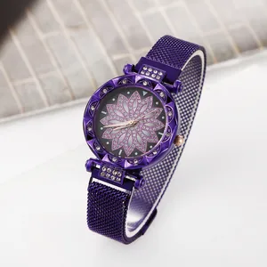 Detail of purple watch face with floral glitter pattern and sparkling rhinestone bezel