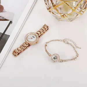 Detailed view of women's gold rhinestone watch and matching bracelet set in an elegant display