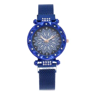 Detail of blue flower dial watch with crystal bezel and magnetic Milanese mesh strap