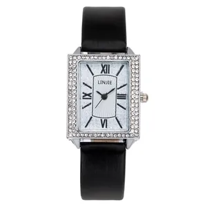 Women's rectangular silver watch with crystal bezel and black leather strap