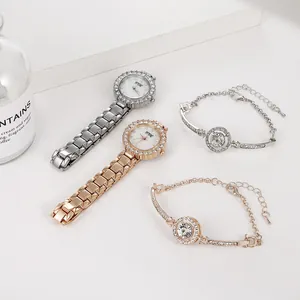 Close-up of elegant rhinestone-studded silver and rose gold watches with matching bracelets