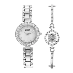 Detail of silver quartz watch and matching crystal bracelet set with rhinestone accents