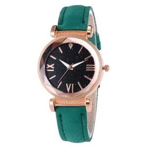 Green leather strap women's watch with rose gold case and starry black dial detail