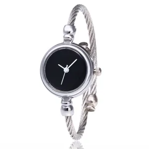 Minimalist silver cable bangle watch with sleek black dial and stainless steel twisted band