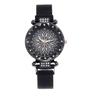 Detail of the flower-pattern dial and crystal-encrusted bezel of this black Milanese watch