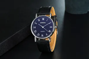 Detail of blue quartz watch dial with silver Roman numerals and black leather strap