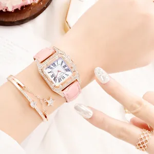 Detail of a square rhinestone watch with pink leather strap and matching star bracelet