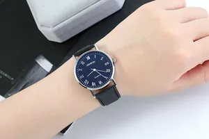 Classic Geneva men's quartz watch with blue dial and black leather strap on a model wrist