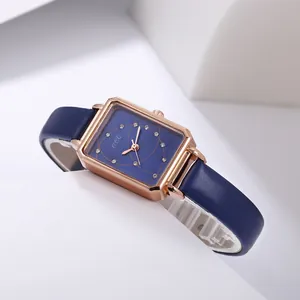 Detailed macro view of square rose gold case with blue dial and diamond markers