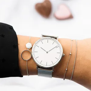 Silver mesh band quartz watch set for women with minimalist dial and layered chain bracelets