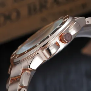 Side view of rose gold quartz watch with diamond accents and steel link bracelet