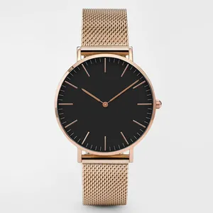 Detailed close-up of rose gold Milanese mesh strap and matte black minimalist dial