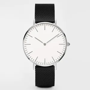 Close-up of minimalist silver quartz watch with white dial and black mesh band