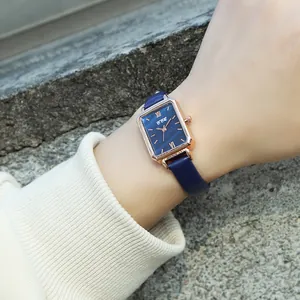 Vintage women's square quartz watch with rose gold case and deep blue leather strap