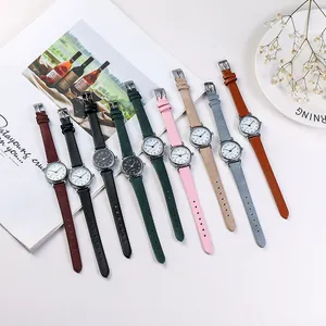 Minimalist women's quartz watch with thin leather strap in multiple colors and silver dial