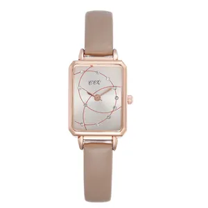 Detail of rectangular rose gold case with rhinestone dial and khaki leather strap