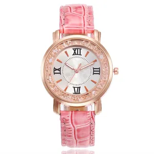 Close-up of women's pink leather watch with rose gold rhinestone bezel and Roman dial