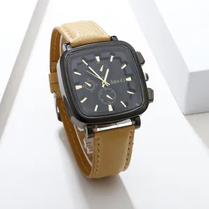 Macro shot of Amadi square watch face with black dial and brown leather strap detail