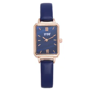 Close-up of vintage square watch with deep blue textured dial and rose gold case