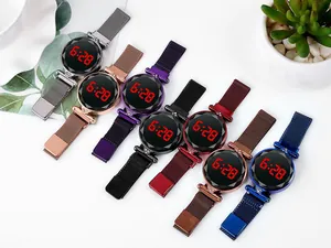 Macro detail of multi-colored LED watches with Milanese magnetic bands and diamond accents