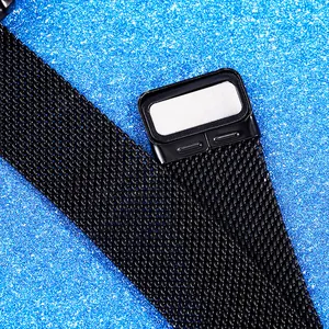 Macro shot of black stainless steel Milanese magnetic watch strap on blue texture