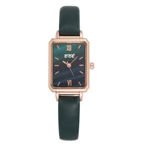 Elegant rose gold rectangular watch with peacock green dial and dark green leather strap