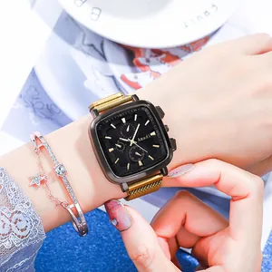 Close-up of a women's square quartz watch with black dial and gold mesh strap