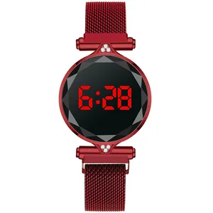 Macro detail of women LED watch with red crystal face, Milanese strap and magnetic buckle