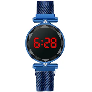 Detail of blue Milanese loop watch with magnetic buckle and red LED digital display
