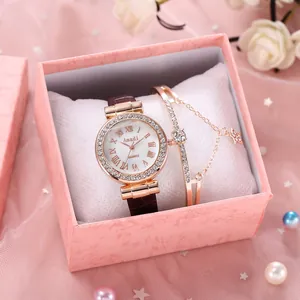 Damen-Quarzuhr und goldenes Stern-Armband in rosa Geschenkbox mit floralen Akzenten