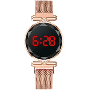 Detailed macro view of the rose gold Milanese mesh strap and red LED digital screen display