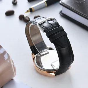Close-up of 20mm black genuine leather watch strap with a classic rose gold buckle