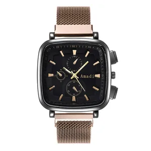 Detail of square black dial with rose gold sub-dials and mesh strap on a quartz watch