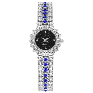 Reloj de cuarzo plateado para mujer con esfera de cielo estrellado y correa con diamantes