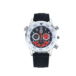 Macro view of silver chronograph case with black silicone strap and red sub-dials
