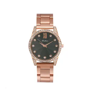 Montre à quartz femme or rose avec lunette en strass et cadran à motif rayons de soleil
