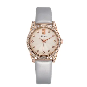 Orologio al quarzo da donna con quadrante champagne, ghiera di cristalli e cinturino grigio