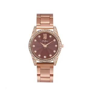 Montre à quartz pour femme en or rose avec lunette en cristal et cadran marron élégant