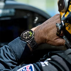 Men's sport watch with black steel band and green brake caliper wheel rim dial design